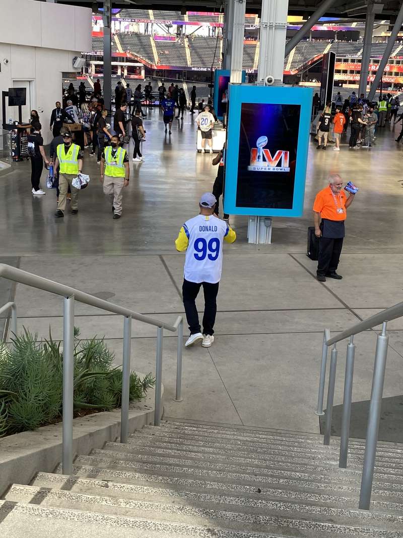 Gary in his Aaron Donald #99 jersey at the Super Bowl LVI concourse