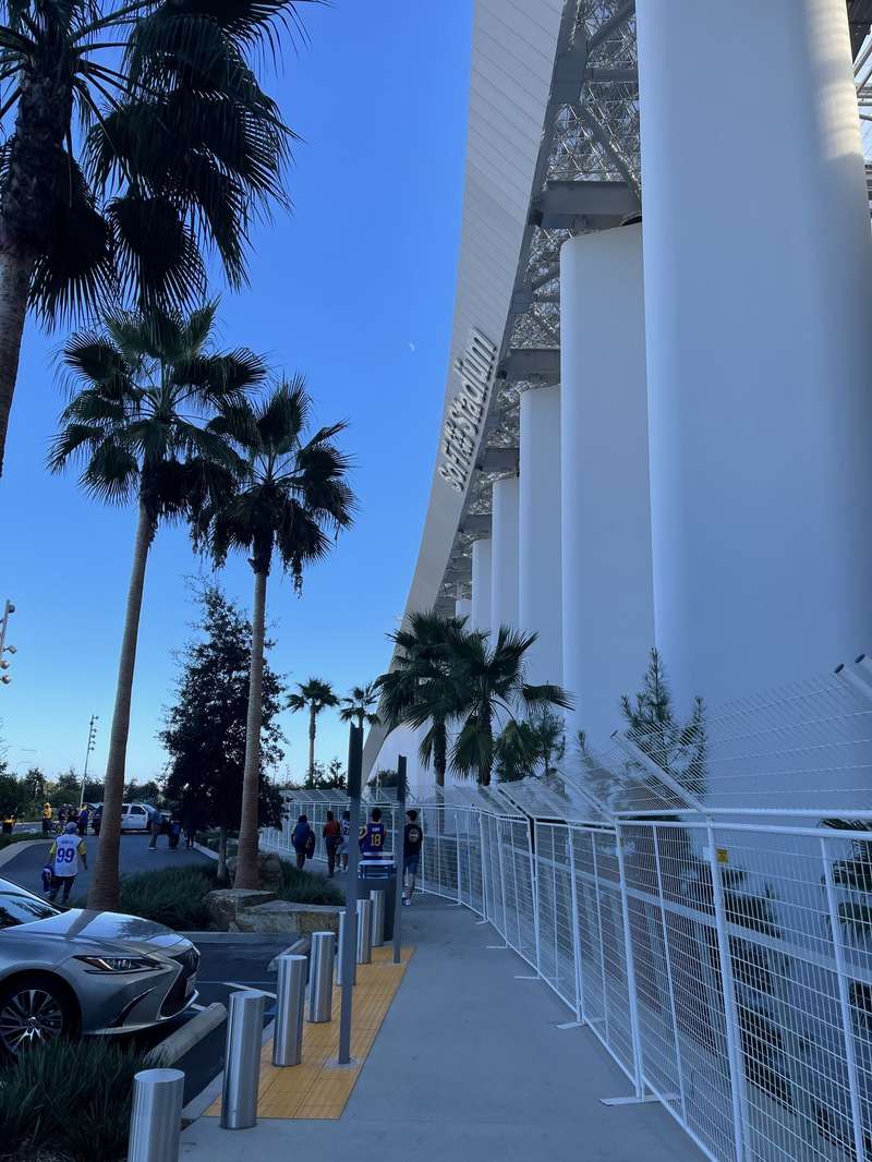 SoFi Stadium exterior with palm trees