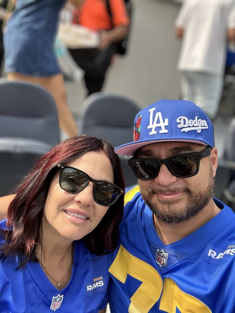 Gary and Stacy in matching Rams jerseys