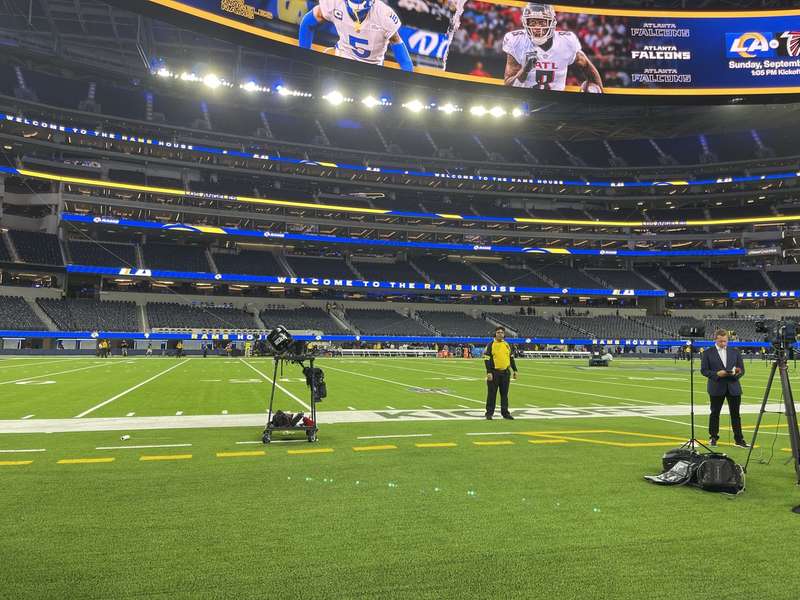 Field-level view Rams vs Falcons, TV crew on field